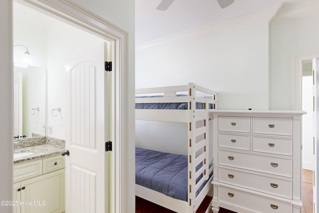 bedroom featuring ceiling fan and crown molding