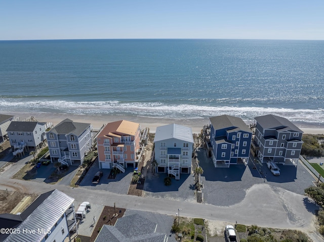 drone / aerial view with a residential view and a water view