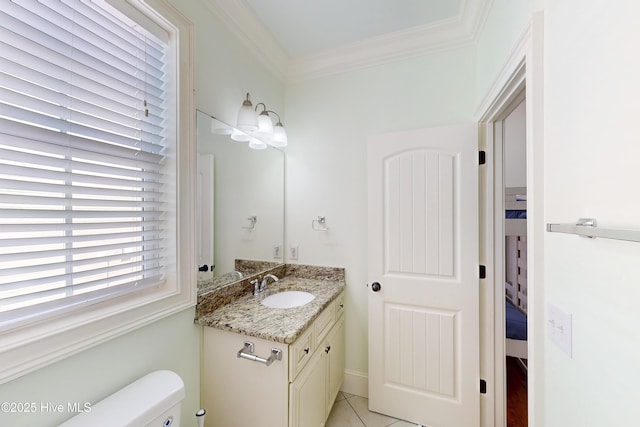 bathroom featuring toilet, crown molding, and vanity