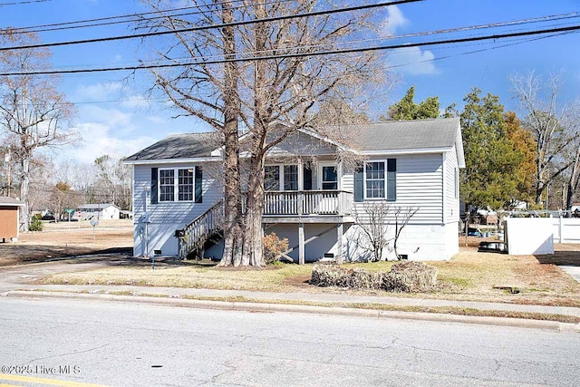 view of front facade with crawl space and stairway