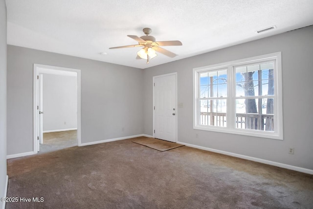 interior space featuring carpet, visible vents, and baseboards