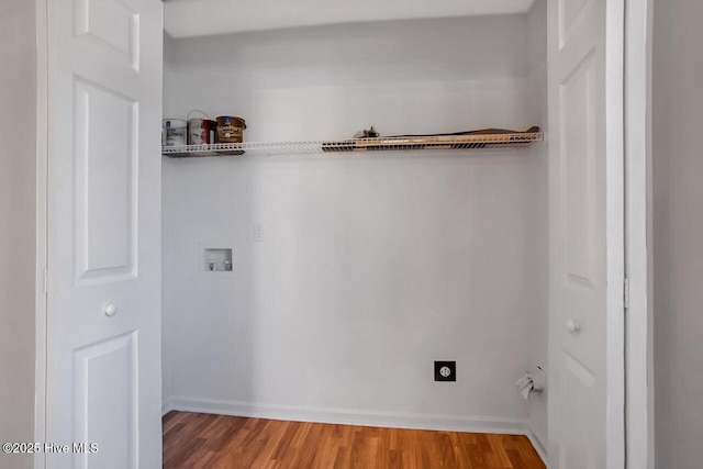 washroom featuring laundry area, wood finished floors, hookup for a washing machine, and hookup for an electric dryer