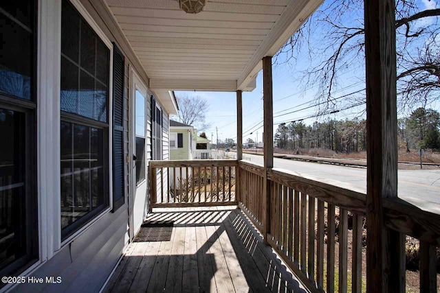 wooden terrace featuring a porch