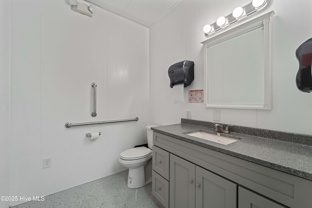 bathroom featuring toilet and vanity