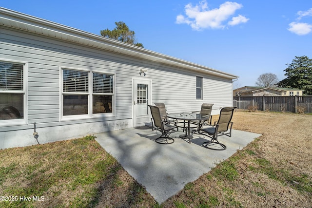 view of patio featuring fence