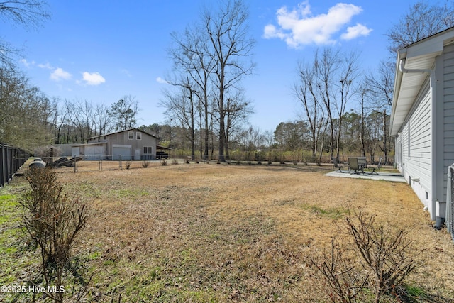 view of yard featuring a patio area and fence