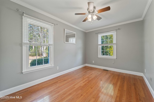 unfurnished room featuring light wood finished floors, baseboards, a ceiling fan, and ornamental molding