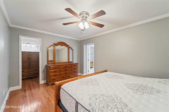 bedroom featuring ceiling fan, ornamental molding, light wood-style flooring, and baseboards