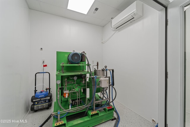 utility room with an AC wall unit and visible vents