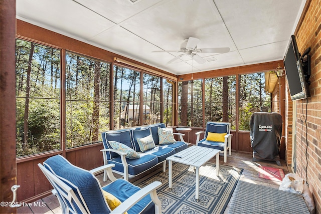 sunroom / solarium with ceiling fan