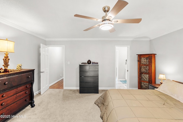 bedroom featuring ceiling fan, ornamental molding, carpet flooring, and baseboards