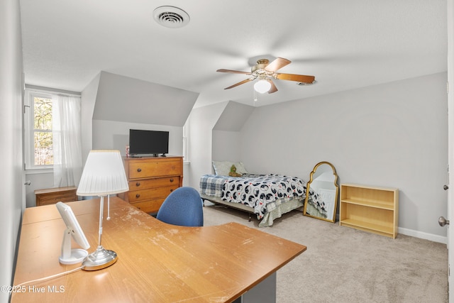 carpeted bedroom with visible vents, vaulted ceiling, baseboards, and ceiling fan