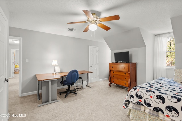 carpeted bedroom with a ceiling fan, baseboards, visible vents, and a textured ceiling