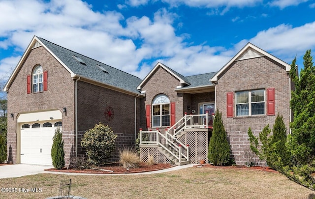 view of front of home featuring an attached garage, brick siding, a shingled roof, concrete driveway, and a front yard