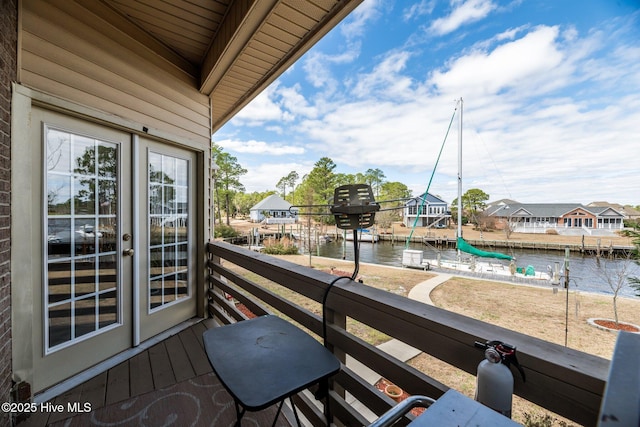 balcony featuring a water view