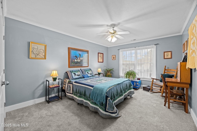 carpeted bedroom with visible vents, baseboards, a ceiling fan, and ornamental molding