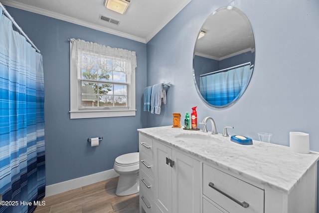 bathroom featuring baseboards, visible vents, toilet, ornamental molding, and wood finished floors