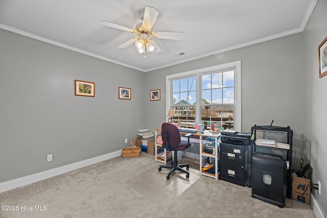 office area with ceiling fan, visible vents, baseboards, carpet, and crown molding