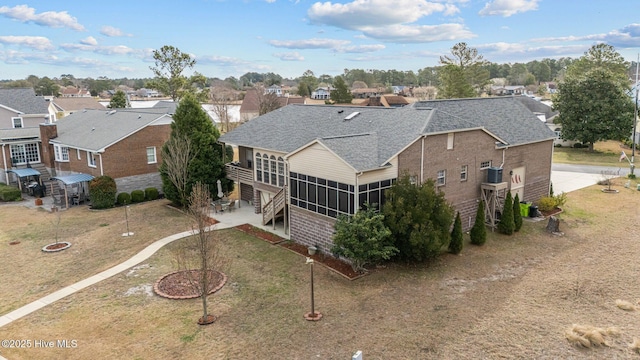 birds eye view of property with a residential view