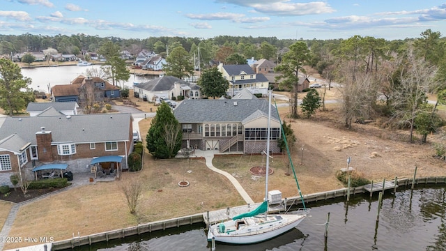 bird's eye view with a water view and a residential view