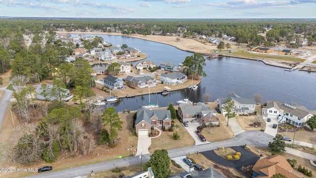 bird's eye view featuring a residential view and a water view