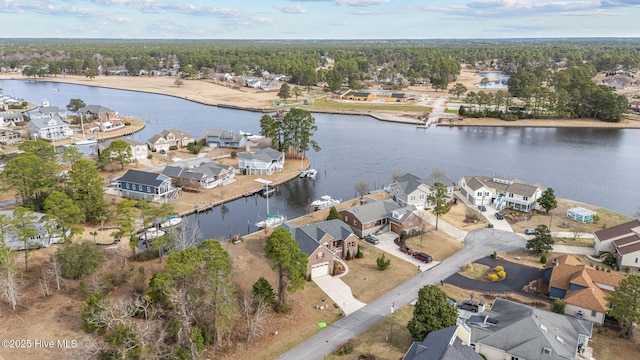 drone / aerial view with a residential view and a water view