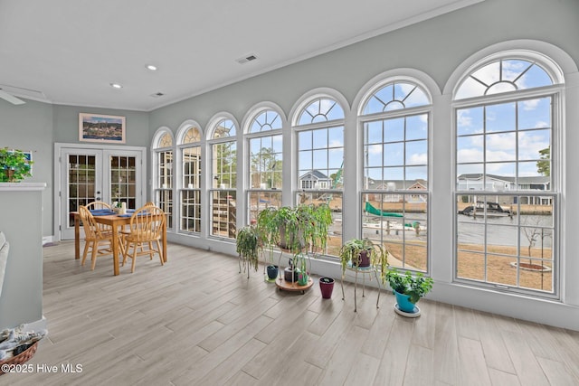 sunroom / solarium featuring french doors and visible vents