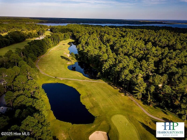 aerial view featuring view of golf course, a water view, and a wooded view