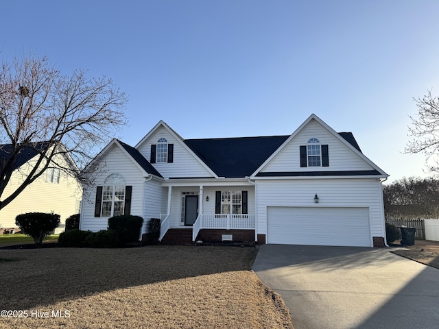 view of front of house with crawl space, fence, a porch, and concrete driveway