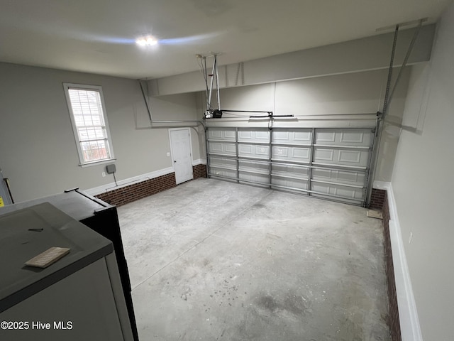 garage featuring baseboards and a garage door opener