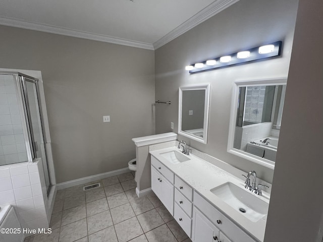 bathroom with a stall shower, crown molding, visible vents, and a sink