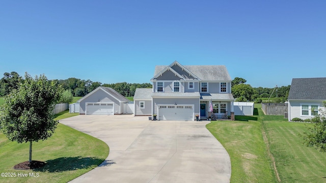 craftsman inspired home with a front lawn and fence