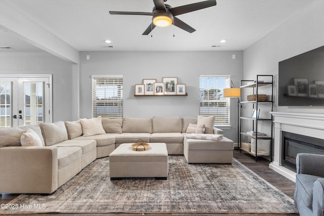 living area featuring a wealth of natural light, recessed lighting, french doors, and wood finished floors