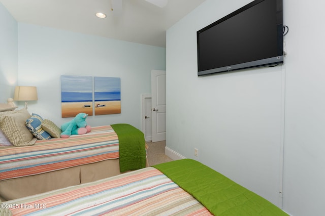 bedroom with baseboards, a ceiling fan, and carpet flooring