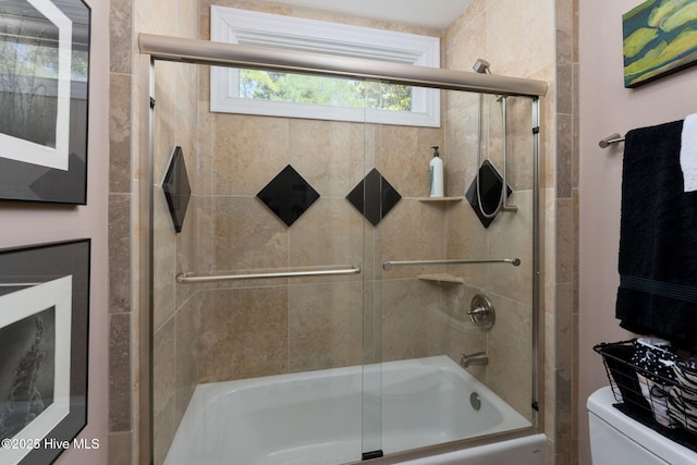 full bath featuring enclosed tub / shower combo and toilet