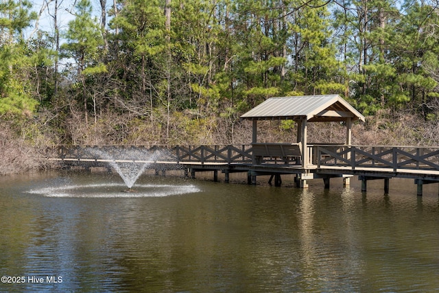 dock area with a gazebo and a water view