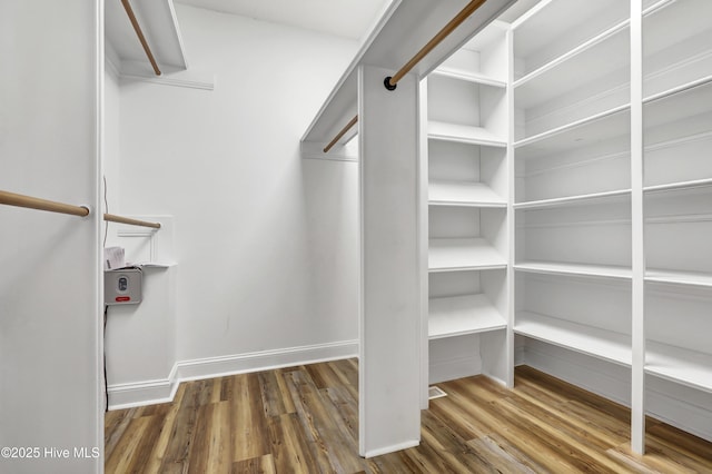 spacious closet with wood finished floors