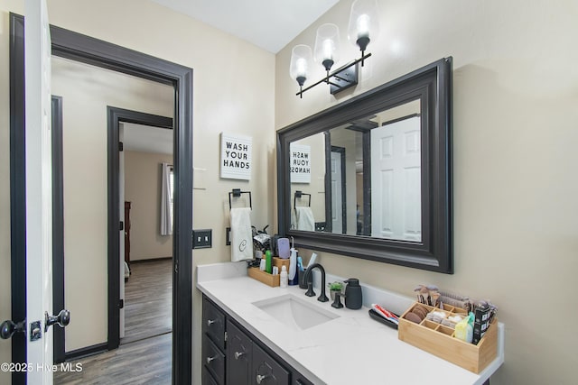 bathroom featuring vanity and wood finished floors