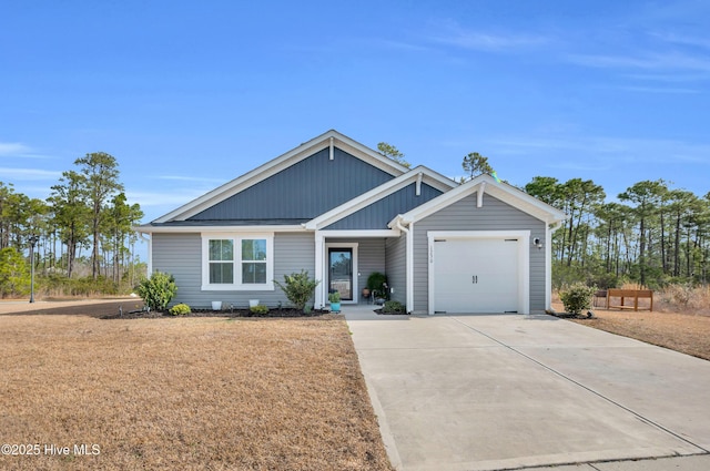 view of front of home with driveway, board and batten siding, and an attached garage