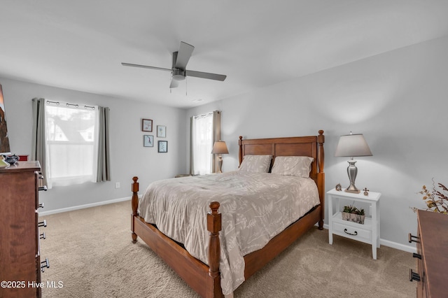 bedroom with baseboards, light carpet, and ceiling fan