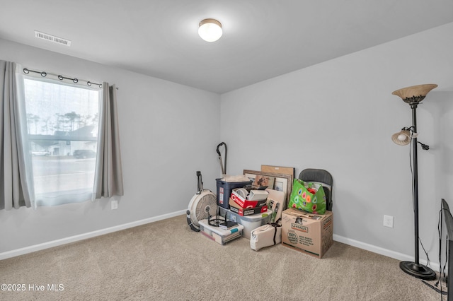 miscellaneous room with visible vents, baseboards, and carpet