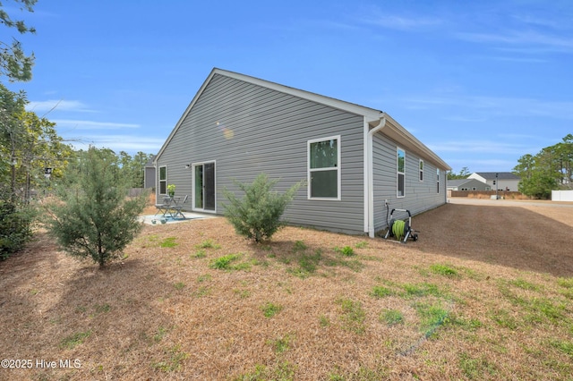 rear view of house featuring a patio