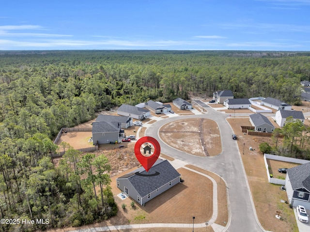 bird's eye view with a forest view