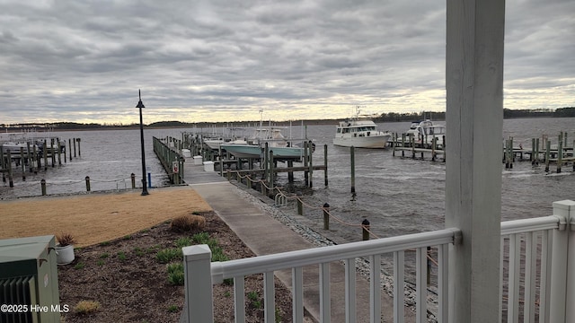 dock area with a water view and boat lift