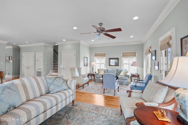 living room featuring a ceiling fan, recessed lighting, stairway, and wood finished floors