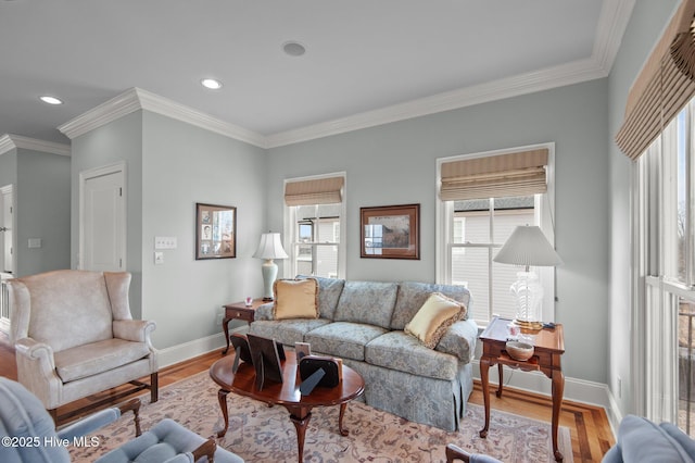 living area featuring ornamental molding, recessed lighting, baseboards, and wood finished floors