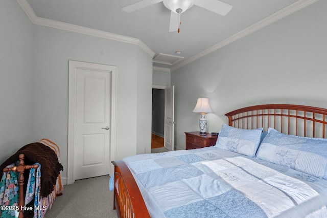 carpeted bedroom featuring attic access, a ceiling fan, and crown molding