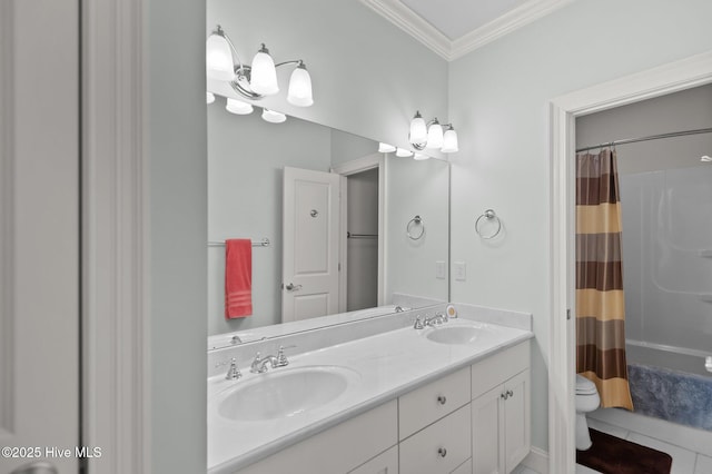 bathroom with toilet, crown molding, double vanity, and a sink