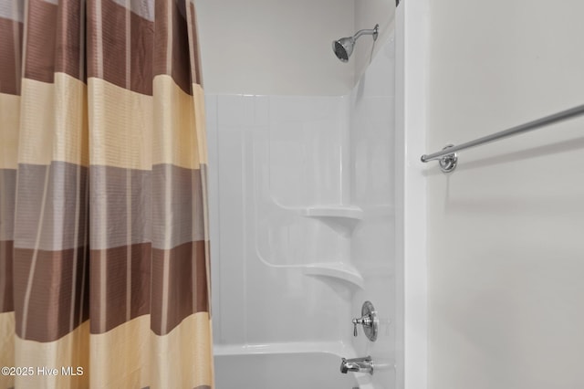 bathroom with shower / bathtub combination with curtain