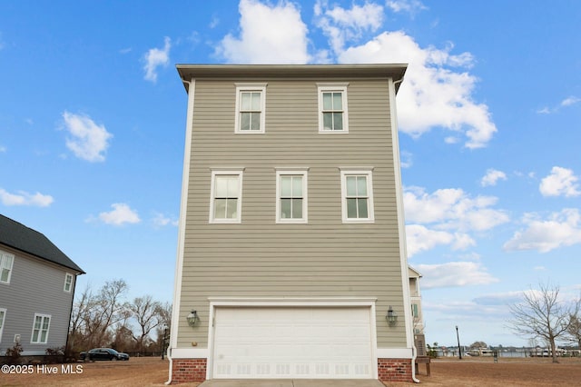 view of front of house with a garage and driveway